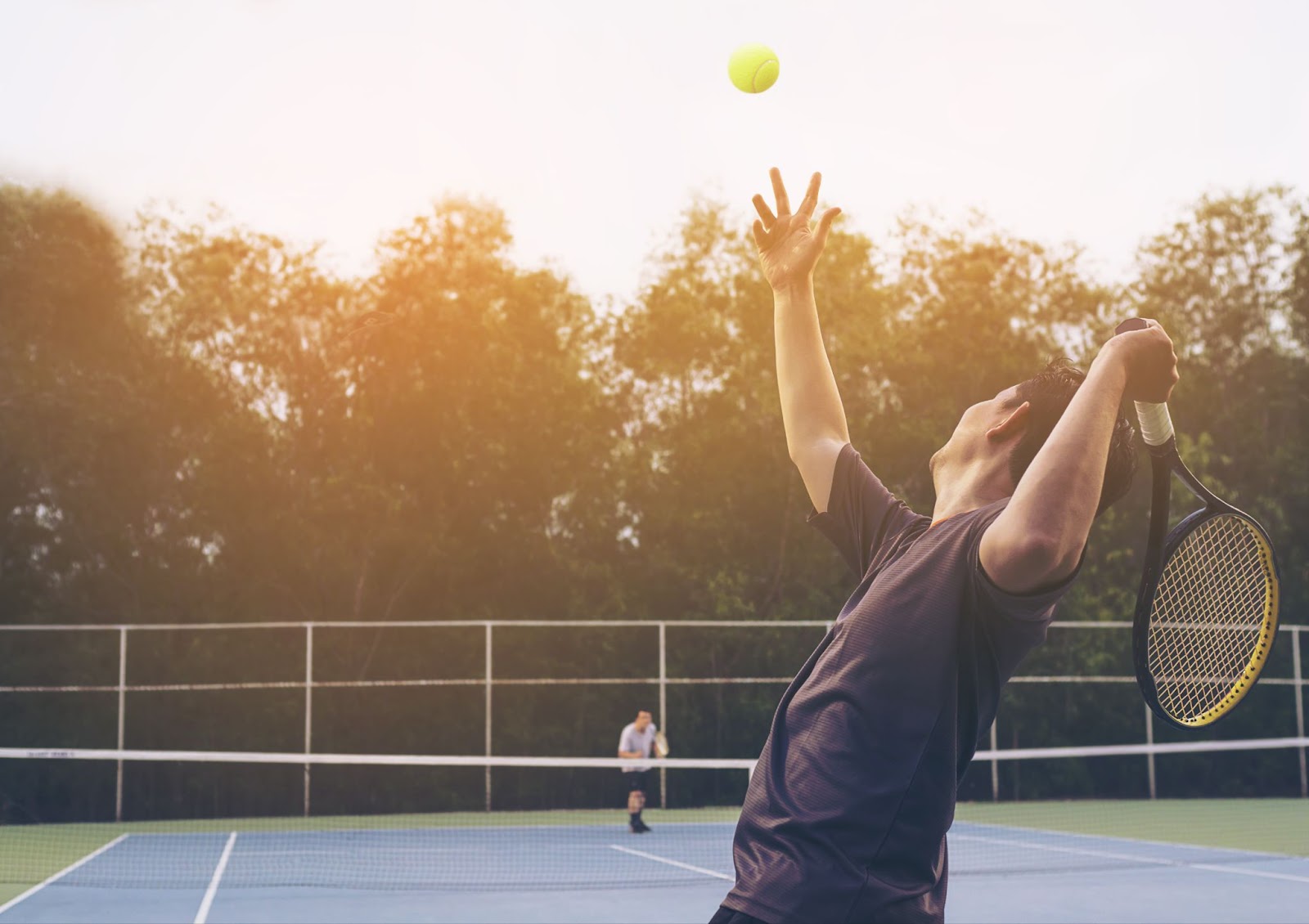 Two people playing tennis